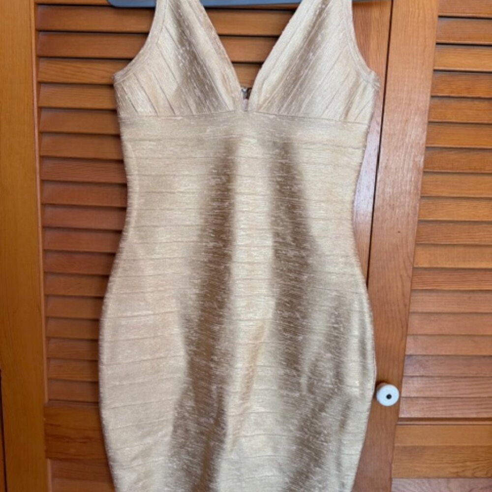 ? NOT SURE TAG GONE. LARGE, GOLD